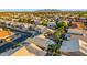 Expansive aerial view showcases the community with desert landscaping, mountain views, and well-maintained streets at 4020 N 151St Dr, Goodyear, AZ 85395