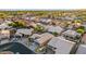 An aerial view of a sprawling community featuring well-manicured lawns and a beautiful desert landscape at 4020 N 151St Dr, Goodyear, AZ 85395