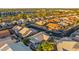 Bird's-eye view of a residential area featuring diverse architectural styles, mature trees, and peaceful neighborhood streets at 4020 N 151St Dr, Goodyear, AZ 85395