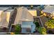 An aerial view of the backyard featuring a patio area with pergola and grill at 4020 N 151St Dr, Goodyear, AZ 85395