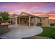 Covered patio with outdoor furniture and landscaped yard at 4020 N 151St Dr, Goodyear, AZ 85395