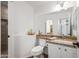 Charming bathroom with a large mirror, granite counters and updated fixtures at 4020 N 151St Dr, Goodyear, AZ 85395