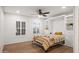 Bright bedroom with Murphy bed, built-in shelves, and plantation shutters at 4020 N 151St Dr, Goodyear, AZ 85395