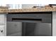 Close up of stainless steel dishwasher with granite countertop and control panel at 4020 N 151St Dr, Goodyear, AZ 85395