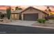 Lovely single-story home with desert landscaping and an attached two-car garage at 4020 N 151St Dr, Goodyear, AZ 85395