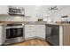 Well-equipped kitchen with stainless steel appliances, white cabinets and granite countertops at 4020 N 151St Dr, Goodyear, AZ 85395