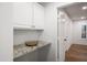 Laundry room features granite countertops and extra cabinet space at 4020 N 151St Dr, Goodyear, AZ 85395