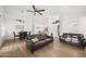 Inviting living room with hardwood floors and modern furniture, open to dining area at 4020 N 151St Dr, Goodyear, AZ 85395