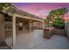 A large covered patio with outdoor seating and bar perfect for entertaining at 4020 N 151St Dr, Goodyear, AZ 85395