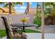 Patio view with cushioned chairs and a table showing the desert landscaping at 4020 N 151St Dr, Goodyear, AZ 85395