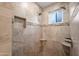 Shower features tile surround, built-in niche and a window at 4020 N 151St Dr, Goodyear, AZ 85395