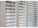 Close-up of white plantation shutters offering privacy and light control at 4020 N 151St Dr, Goodyear, AZ 85395