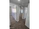 View of a bedroom through a doorway with carpeted floors and neutral walls at 4043 W Palomino Rd, Phoenix, AZ 85019