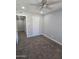 Bedroom featuring carpeted floor, ceiling fan, and closet at 4043 W Palomino Rd, Phoenix, AZ 85019