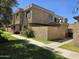 Charming multi-story townhome with well-maintained landscaping and stucco facade at 4043 W Palomino Rd, Phoenix, AZ 85019