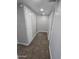 Neutral-toned hallway with carpeted floor and storage space at 4043 W Palomino Rd, Phoenix, AZ 85019