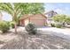 Charming single-story home featuring low-maintenance desert landscaping and a two-car garage at 41341 W Little Dr, Maricopa, AZ 85138