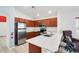 Modern kitchen featuring stainless steel appliances, granite countertops, and ample cabinet space at 41341 W Little Dr, Maricopa, AZ 85138