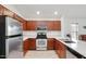 Bright kitchen featuring stainless steel appliances, ample cabinet space, and granite countertops at 41341 W Little Dr, Maricopa, AZ 85138