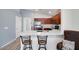 Modern kitchen featuring a breakfast bar, granite countertops, and stainless steel appliances at 41341 W Little Dr, Maricopa, AZ 85138