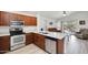 Modern kitchen featuring stainless steel appliances, granite countertops, and an open floor plan at 41341 W Little Dr, Maricopa, AZ 85138