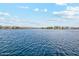 Wide shot of a serene lake surrounded by homes, offering a beautiful community view at 41341 W Little Dr, Maricopa, AZ 85138