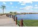 Scenic lake view with lush landscaping, offering a serene and picturesque setting at 41341 W Little Dr, Maricopa, AZ 85138