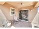 A cozy covered patio with comfortable seating, ideal for relaxing or entertaining guests at 41341 W Little Dr, Maricopa, AZ 85138