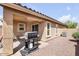 A covered patio with a BBQ grill, perfect for outdoor cooking and entertainment at 41341 W Little Dr, Maricopa, AZ 85138