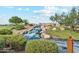 Picturesque view of a water feature with rocks and lush landscaping, offering a serene and inviting atmosphere at 41341 W Little Dr, Maricopa, AZ 85138