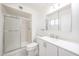 Modern bathroom featuring a glass-enclosed shower, single sink vanity, and neutral color scheme at 4153 W Sunnyside Ave, Phoenix, AZ 85029