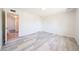 Bedroom with stylish flooring, doorway to another room, and a closet for storage at 4153 W Sunnyside Ave, Phoenix, AZ 85029