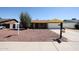 Charming single-story brick home with a well-maintained, low maintenance rock front yard at 4153 W Sunnyside Ave, Phoenix, AZ 85029