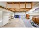 A spacious garage with an overhead storage system, shelving, and utility sink at 4153 W Sunnyside Ave, Phoenix, AZ 85029