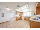 Well-lit kitchen features ample cabinetry, tile floor, and bright countertops at 4153 W Sunnyside Ave, Phoenix, AZ 85029