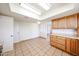 Well-lit kitchen features ample cabinetry, tile floor, and bright countertops at 4153 W Sunnyside Ave, Phoenix, AZ 85029