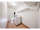 Laundry room with tile floors, a washing machine, and access to the backyard at 4153 W Sunnyside Ave, Phoenix, AZ 85029