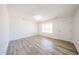 Bright living room features modern flooring, a large window, and a welcoming front door at 4153 W Sunnyside Ave, Phoenix, AZ 85029