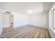 Spacious living room with wood floors, great natural light, and open floor plan at 4153 W Sunnyside Ave, Phoenix, AZ 85029