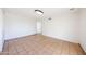 Bright, open living room showcasing neutral tile floors and seamless transitions to other living spaces at 4153 W Sunnyside Ave, Phoenix, AZ 85029