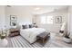 Bright bedroom with natural light, stylish decor, and a comfortable queen-sized bed at 4153 W Sunnyside Ave, Phoenix, AZ 85029