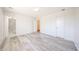 Inviting bedroom with modern floors, showcasing doorways to the en suite bathroom and closet at 4153 W Sunnyside Ave, Phoenix, AZ 85029