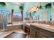 Bright bathroom with dual sinks, soaking tub, step in shower, and large window with a view at 41910 N Long Cove Way, Anthem, AZ 85086