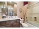 Clean bathroom features tub/shower combination, sink, and neutral wall color at 41910 N Long Cove Way, Anthem, AZ 85086