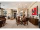 Formal dining room featuring a wood table, upholstered chairs, and decorative wall art at 41910 N Long Cove Way, Anthem, AZ 85086