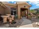 Inviting home featuring custom concrete water features, a gravel yard, and an arched entry at 41910 N Long Cove Way, Anthem, AZ 85086