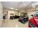Spacious garage features epoxy floors, multiple bays, and storage at 41910 N Long Cove Way, Anthem, AZ 85086