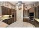 Stylish kitchen featuring custom wood cabinetry, granite countertops, and stainless steel appliances at 41910 N Long Cove Way, Anthem, AZ 85086