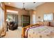 Another view of the warm, inviting main bedroom with ceiling fan, and closet at 41910 N Long Cove Way, Anthem, AZ 85086