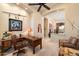 Spacious office featuring a decorative ceiling fan, desk, and bright neutral walls at 41910 N Long Cove Way, Anthem, AZ 85086